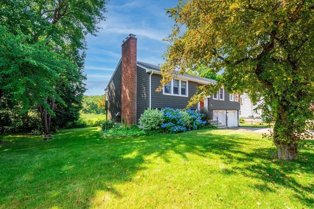 23 Glover Road Needham, MA 02494 - Photo 5 of 40 a front view of a house with garden