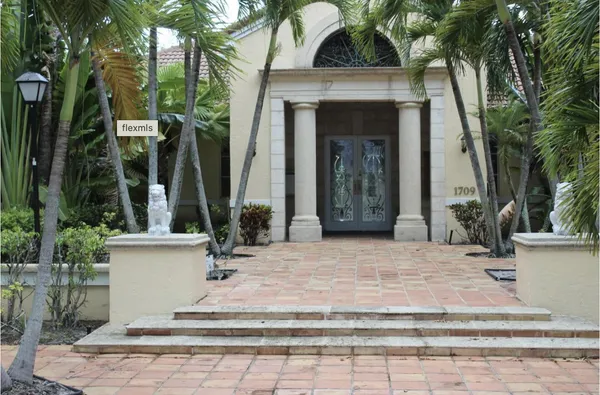 a view of house with yard
