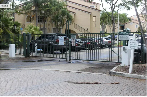 a view of a house with a fence