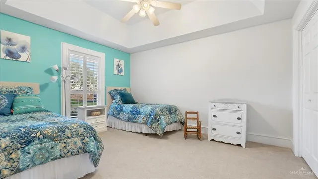 a spacious bedroom with a bed and a window