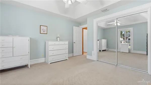 a bathroom with a double vanity sink toilet and a mirror