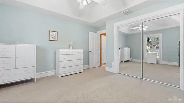 a bathroom with a double vanity sink toilet and a mirror