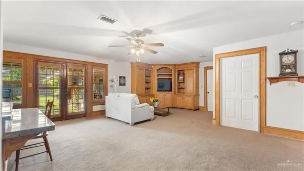 a living room with furniture and a window