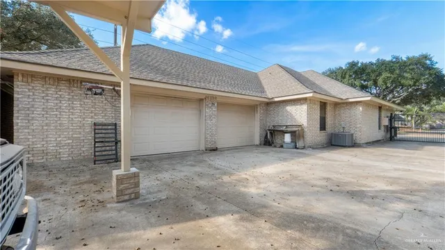 a view of a house with a yard and garage