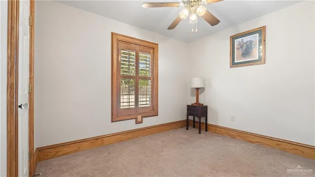 a bathroom with a granite countertop sink toilet a mirror and shower