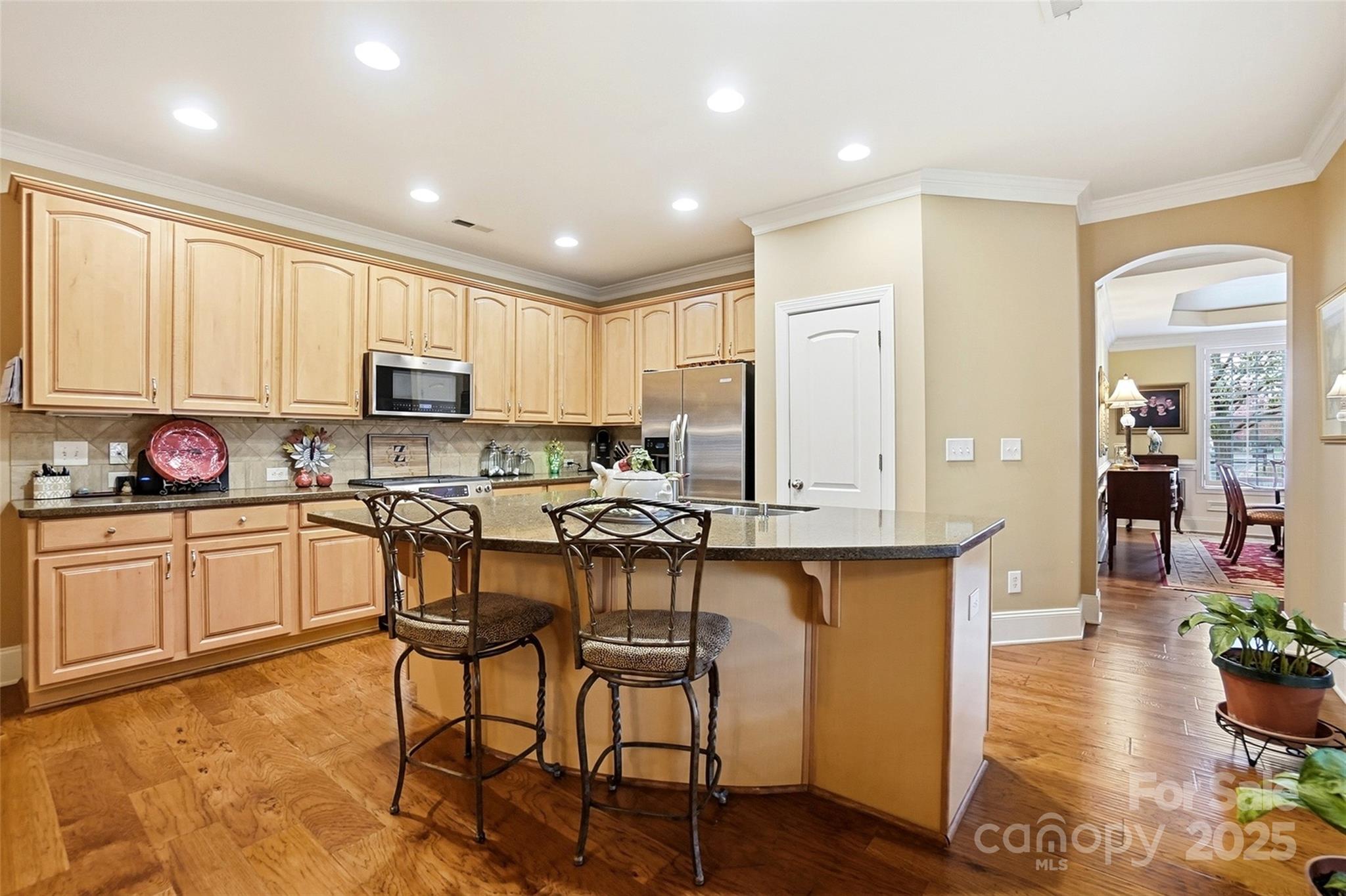 7200 Firespike Road Charlotte, NC 28277 - Photo 13 of 48 a kitchen with sink a microwave and cabinets