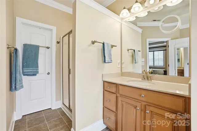 a bathroom with a sink vanity and a mirror