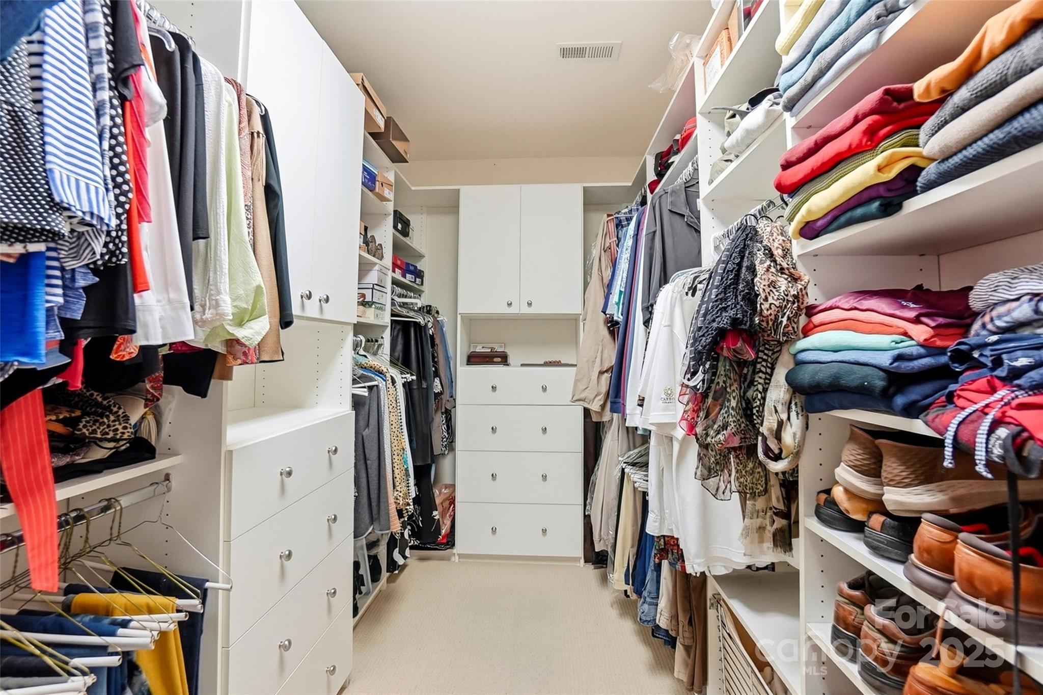 7200 Firespike Road Charlotte, NC 28277 - Photo 32 of 48 a view of walk in closet with clothes and shoes