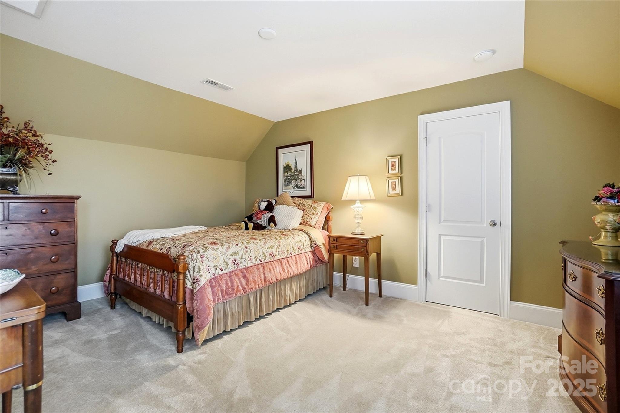 7200 Firespike Road Charlotte, NC 28277 - Photo 41 of 48 a bedroom with a bed and a table in it