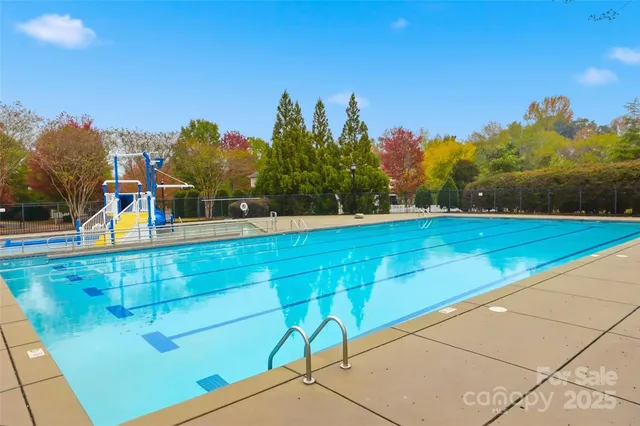 a view of a tennis ground with a sitting area