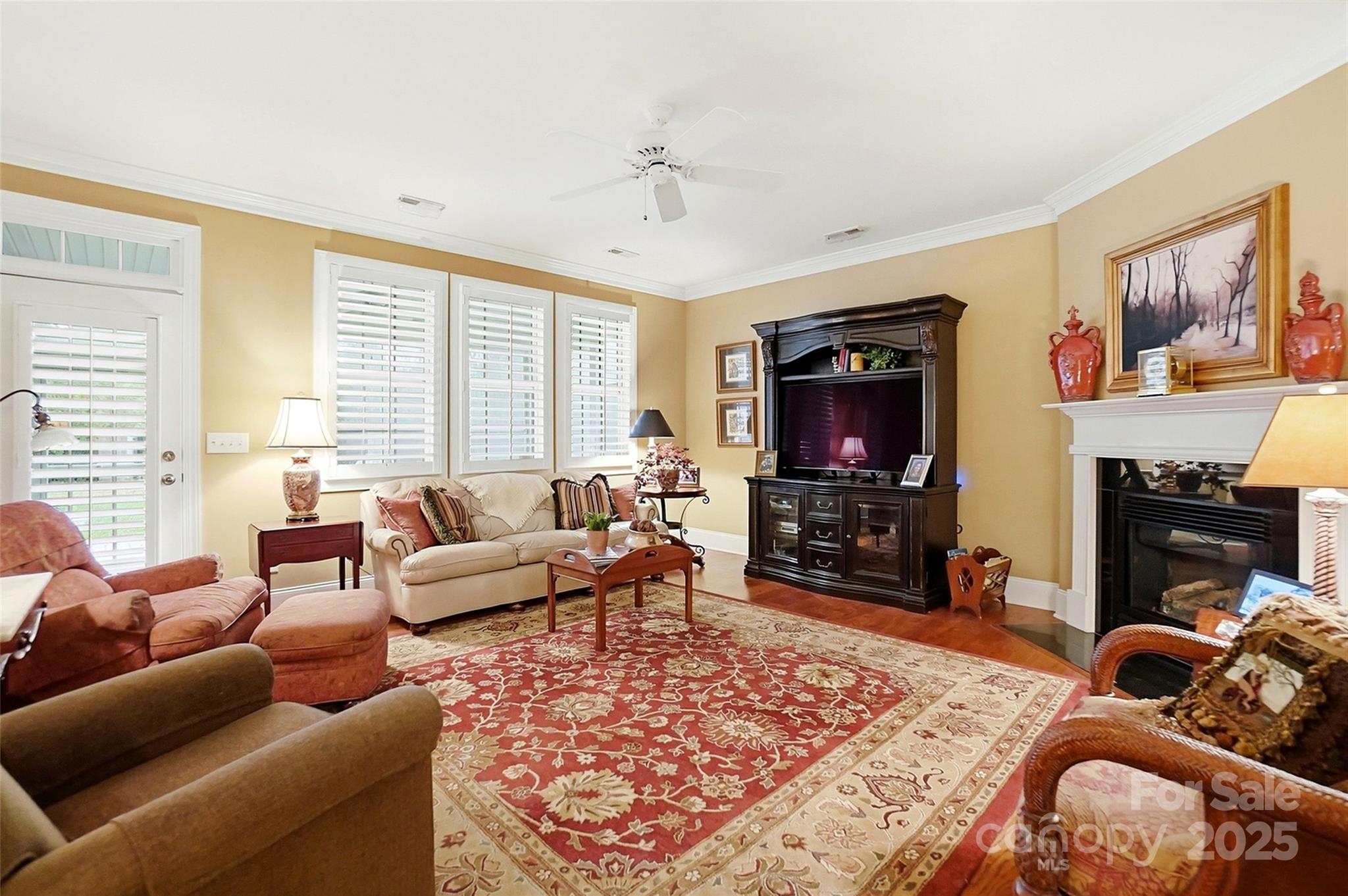 7200 Firespike Road Charlotte, NC 28277 - Photo 7 of 48 a living room with furniture a flat screen tv and a fireplace