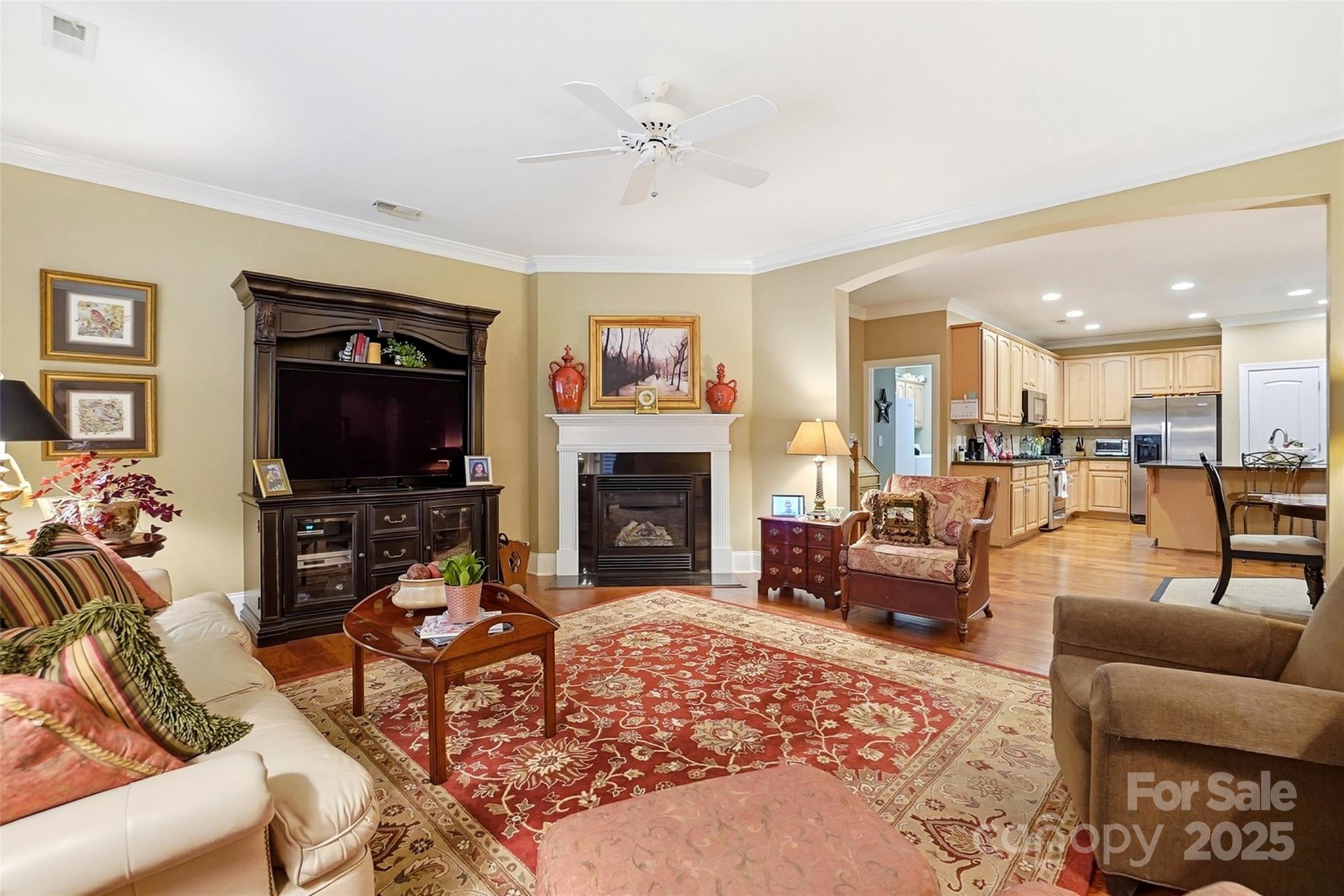 7200 Firespike Road Charlotte, NC 28277 - Photo 8 of 48 a living room with furniture a flat screen tv and a fireplace