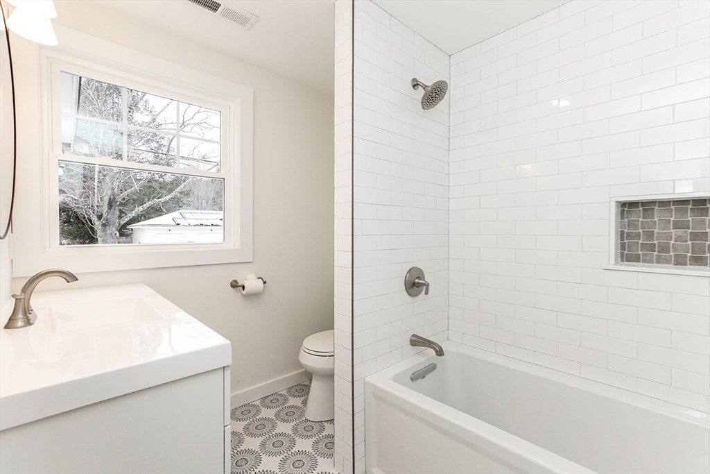 40 Great Road Maynard, MA 01754 - Photo 20 of 30 a bathroom with a sink a window and a shower