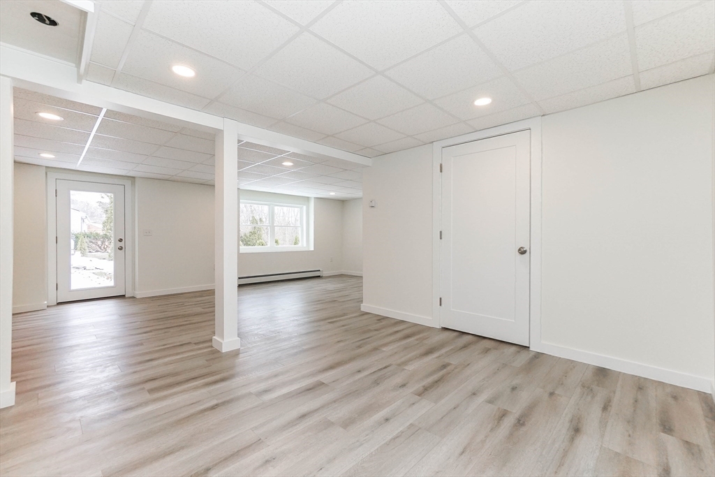 40 Great Road Maynard, MA 01754 - Photo 24 of 30 an empty room with wooden floor and windows