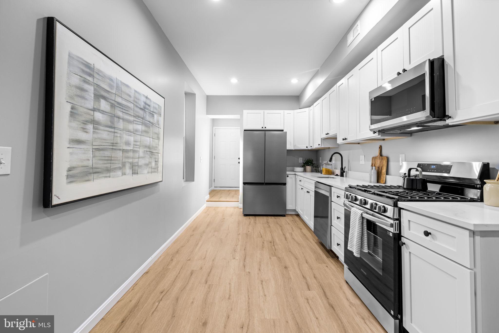 3212 Keswick Road Baltimore, MD 21211 - Photo 10 of 27 Fully Renovated Kitchen With Quartz Countertops