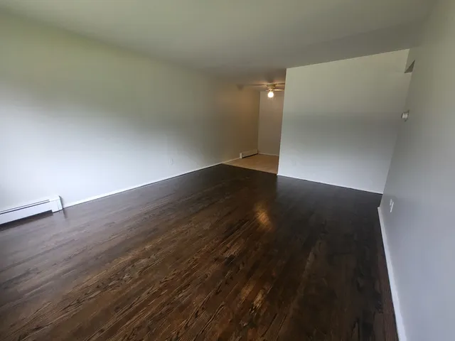 an empty room with wooden floor