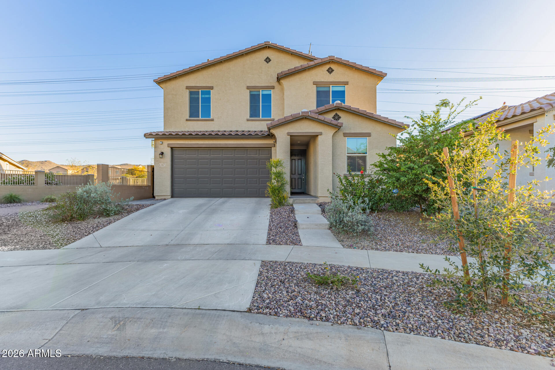 1317 East Fremont Road Phoenix, AZ 85042 - Photo 2 of 41 a view of a white house with large windows and yard