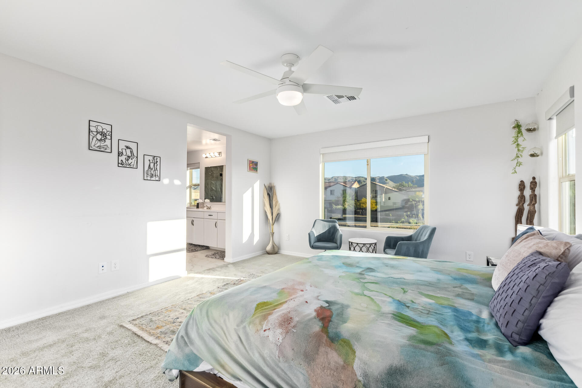 1317 East Fremont Road Phoenix, AZ 85042 - Photo 23 of 41 a large bedroom with a bed and a large window with the outer view