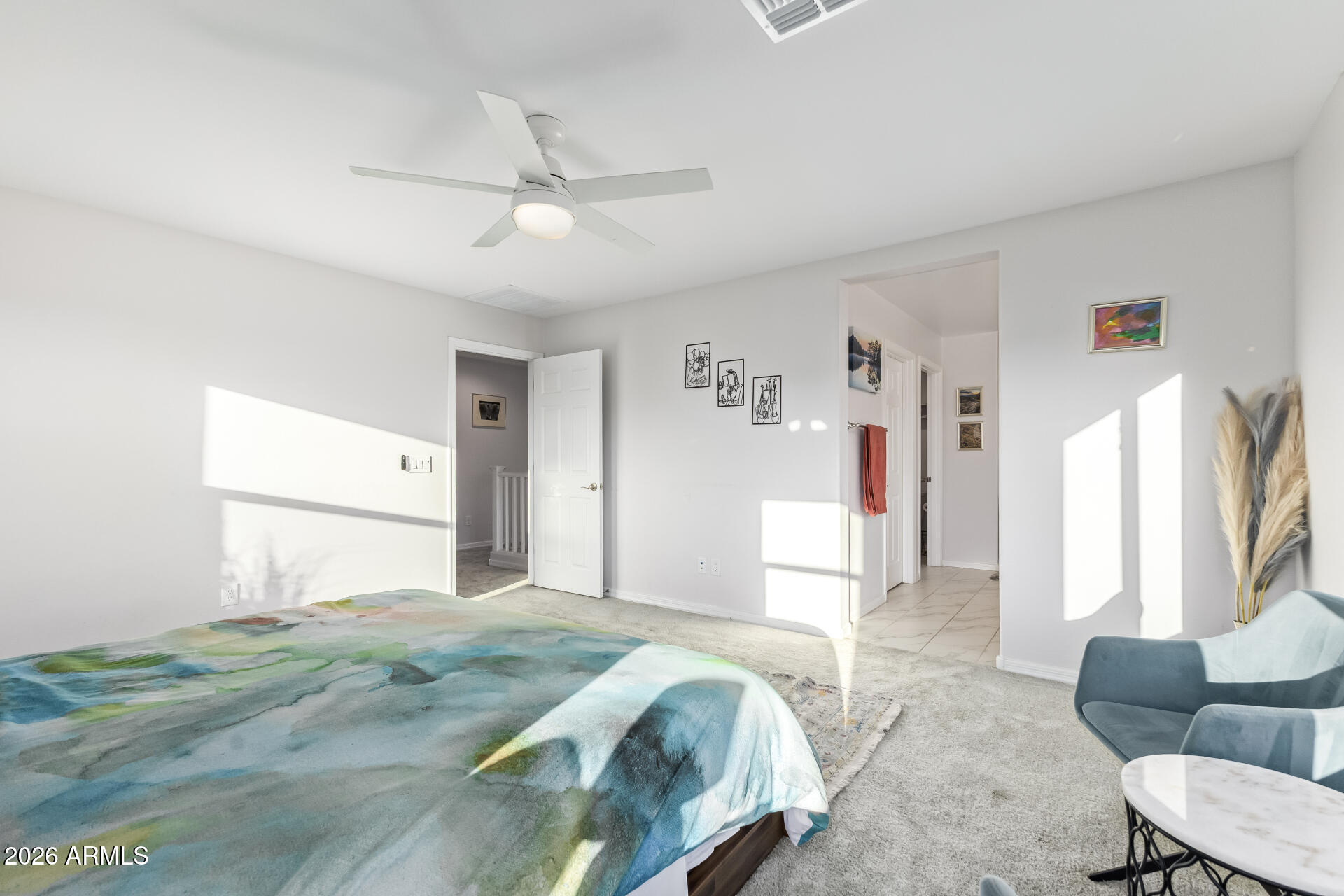 1317 East Fremont Road Phoenix, AZ 85042 - Photo 24 of 41 a bedroom with a bed couch and a window