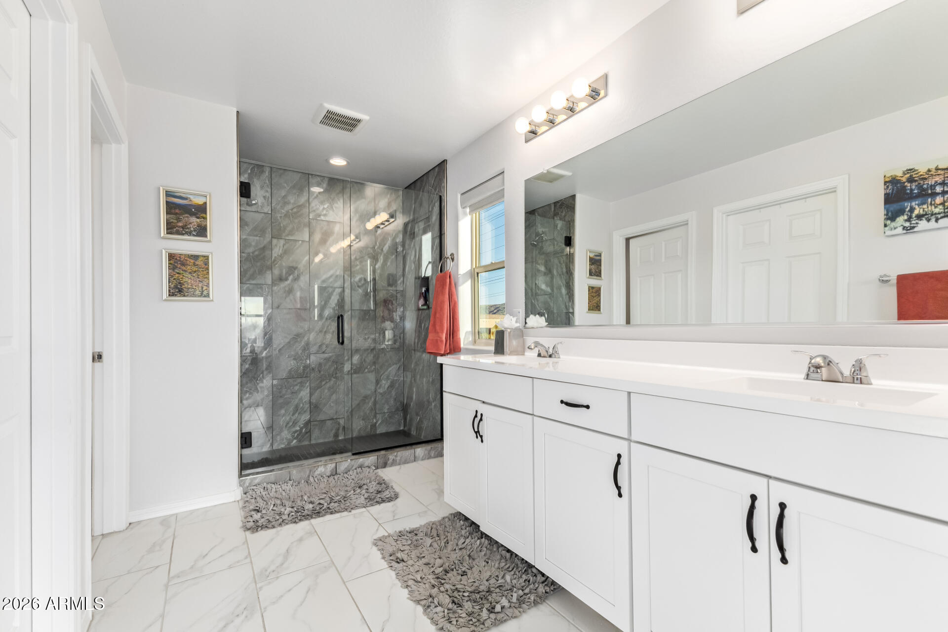 1317 East Fremont Road Phoenix, AZ 85042 - Photo 25 of 41 a spacious bathroom with a shower sink and mirror