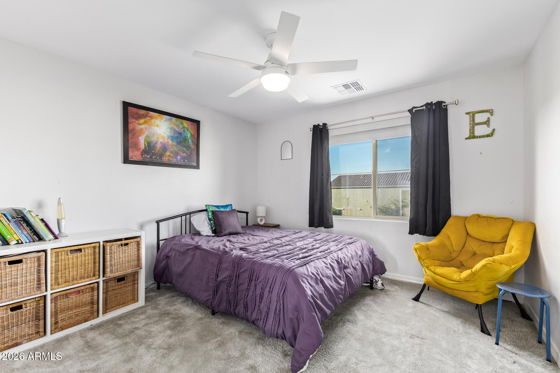 1317 East Fremont Road Phoenix, AZ 85042 - Photo 34 of 41 a bedroom with a bed and chair