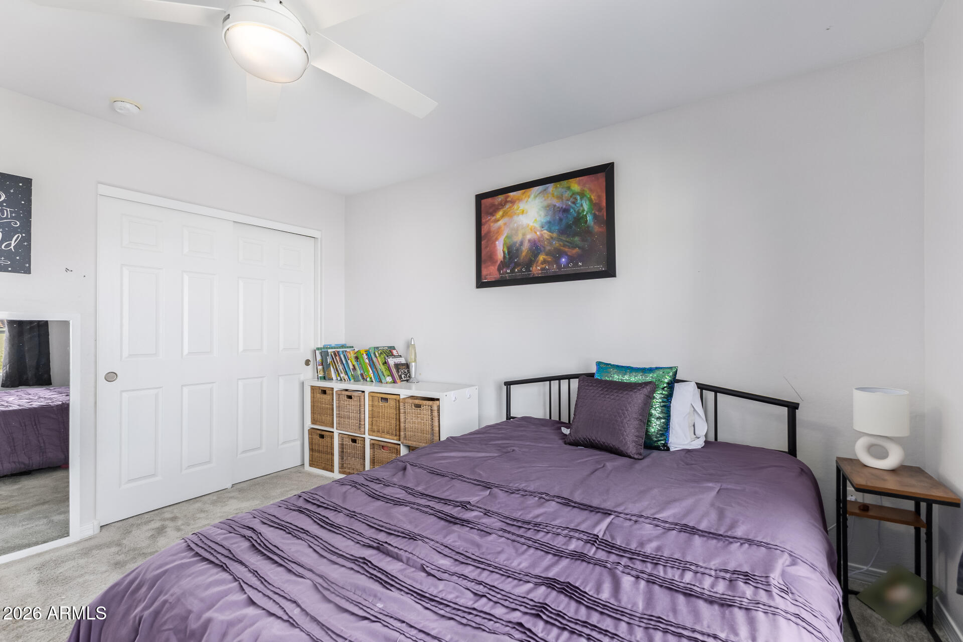 1317 East Fremont Road Phoenix, AZ 85042 - Photo 35 of 41 a bedroom with a bed and wooden floor
