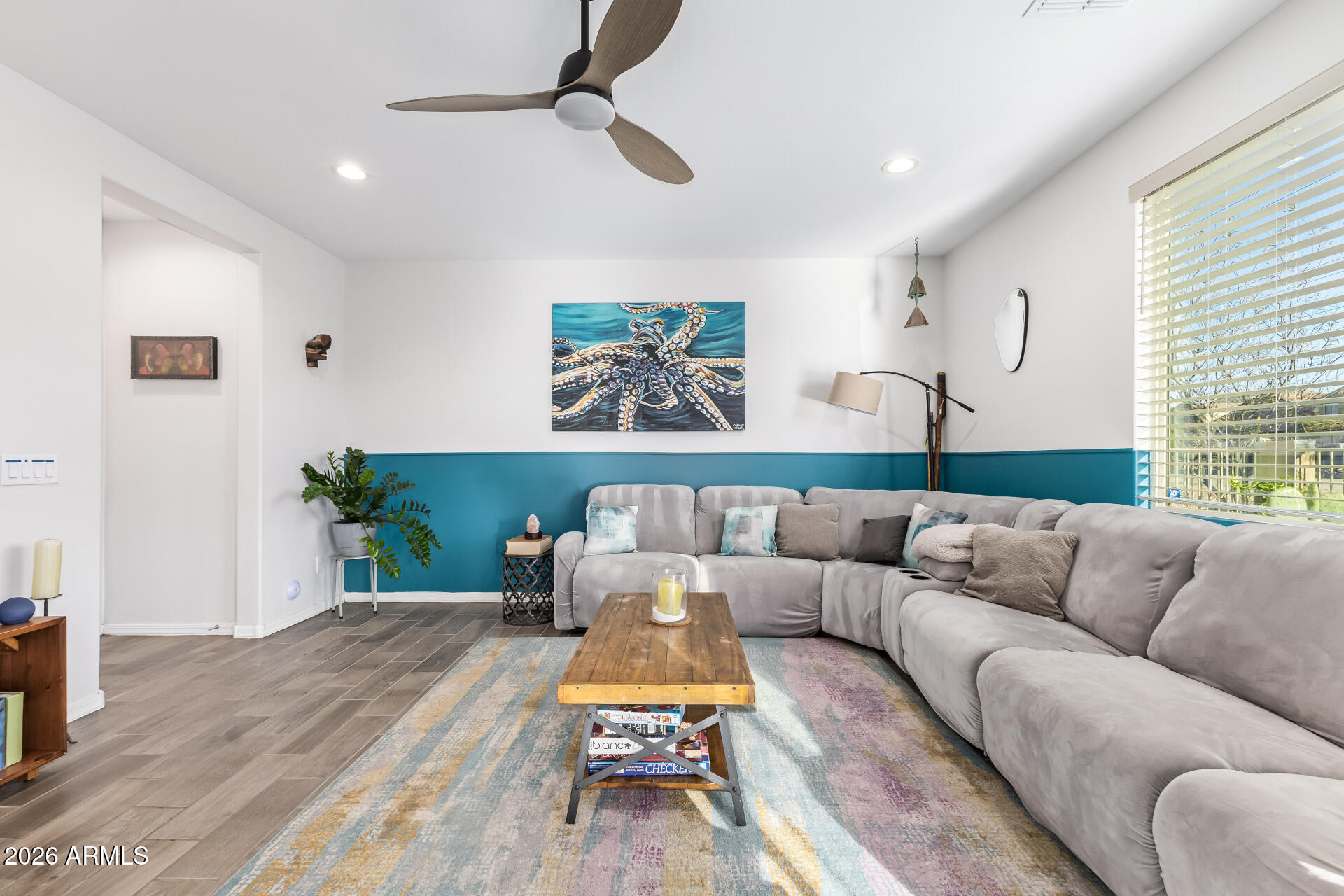 1317 East Fremont Road Phoenix, AZ 85042 - Photo 10 of 41 a living room with furniture or couch and a wooden floor