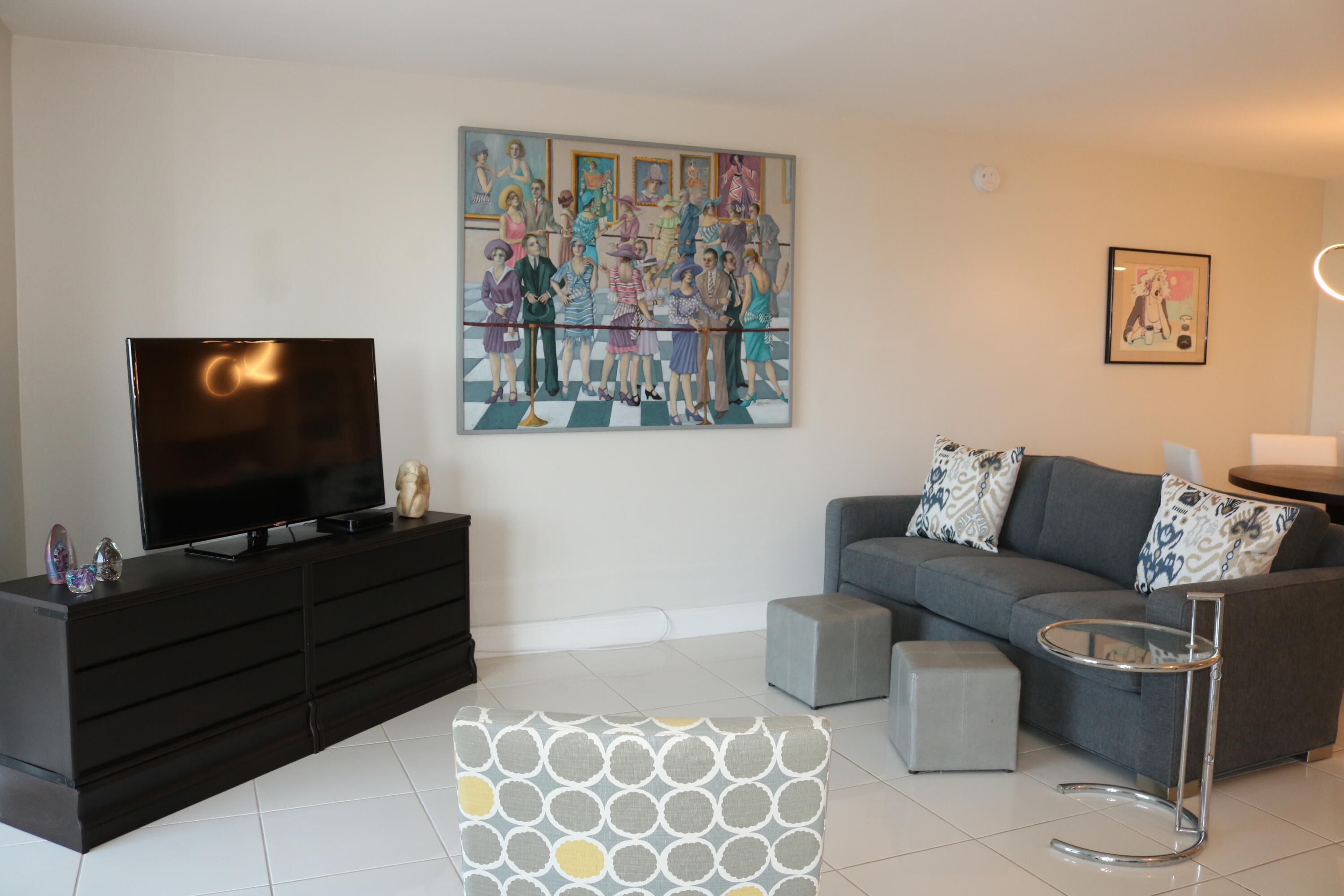 6461 Northwest 2nd Avenue, Unit 508 Boca Raton, FL 33487 - Photo 15 of 39 a living room with furniture and a flat screen tv