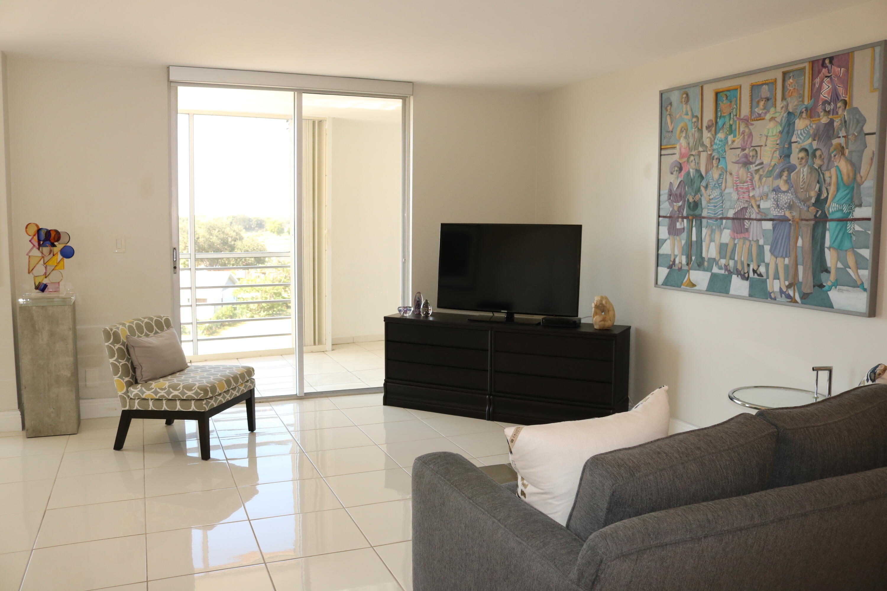 6461 Northwest 2nd Avenue, Unit 508 Boca Raton, FL 33487 - Photo 17 of 39 a living room with furniture and a flat screen tv
