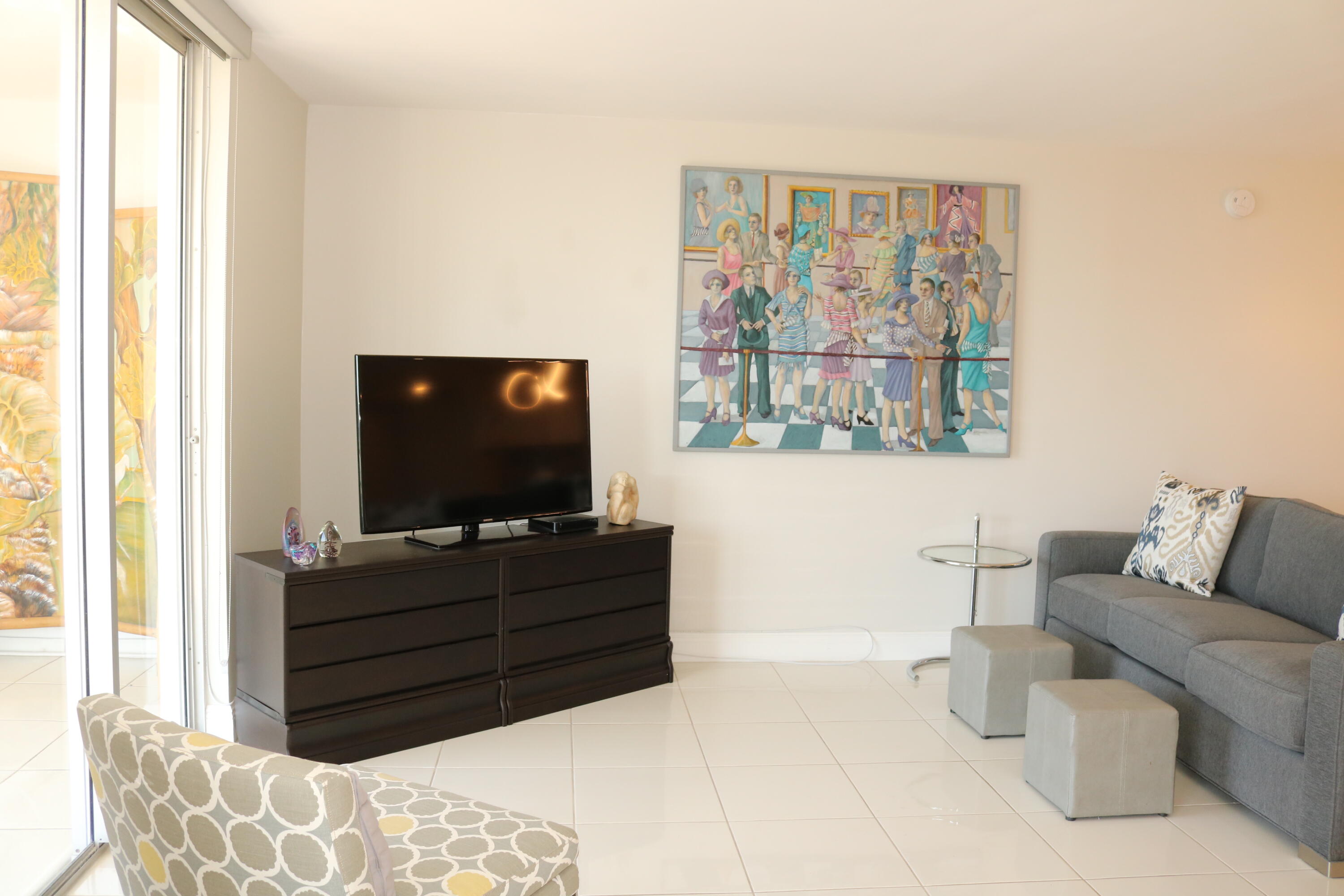 6461 Northwest 2nd Avenue, Unit 508 Boca Raton, FL 33487 - Photo 18 of 39 a living room with furniture and a flat screen tv