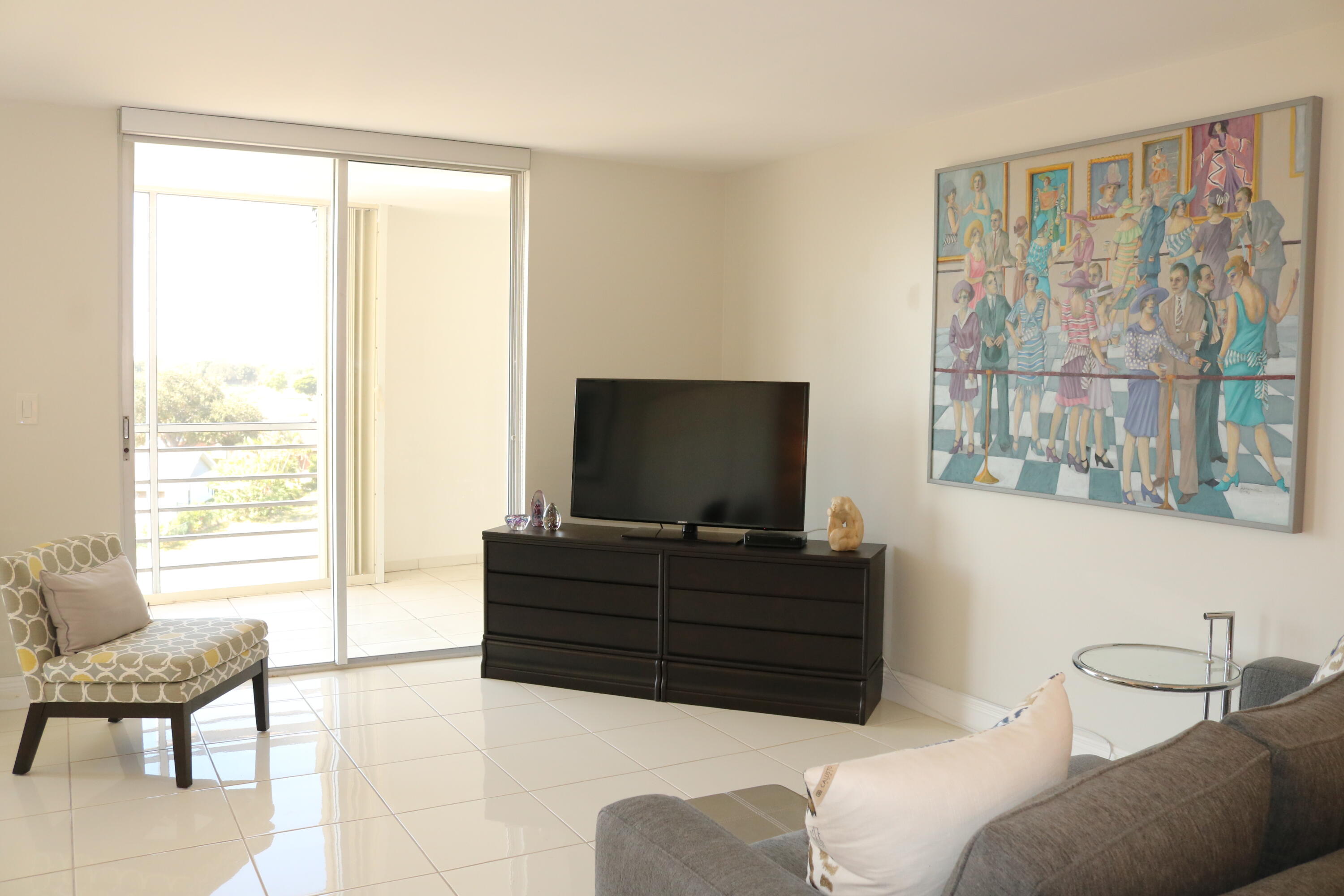 6461 Northwest 2nd Avenue, Unit 508 Boca Raton, FL 33487 - Photo 19 of 39 a living room with furniture and a flat screen tv