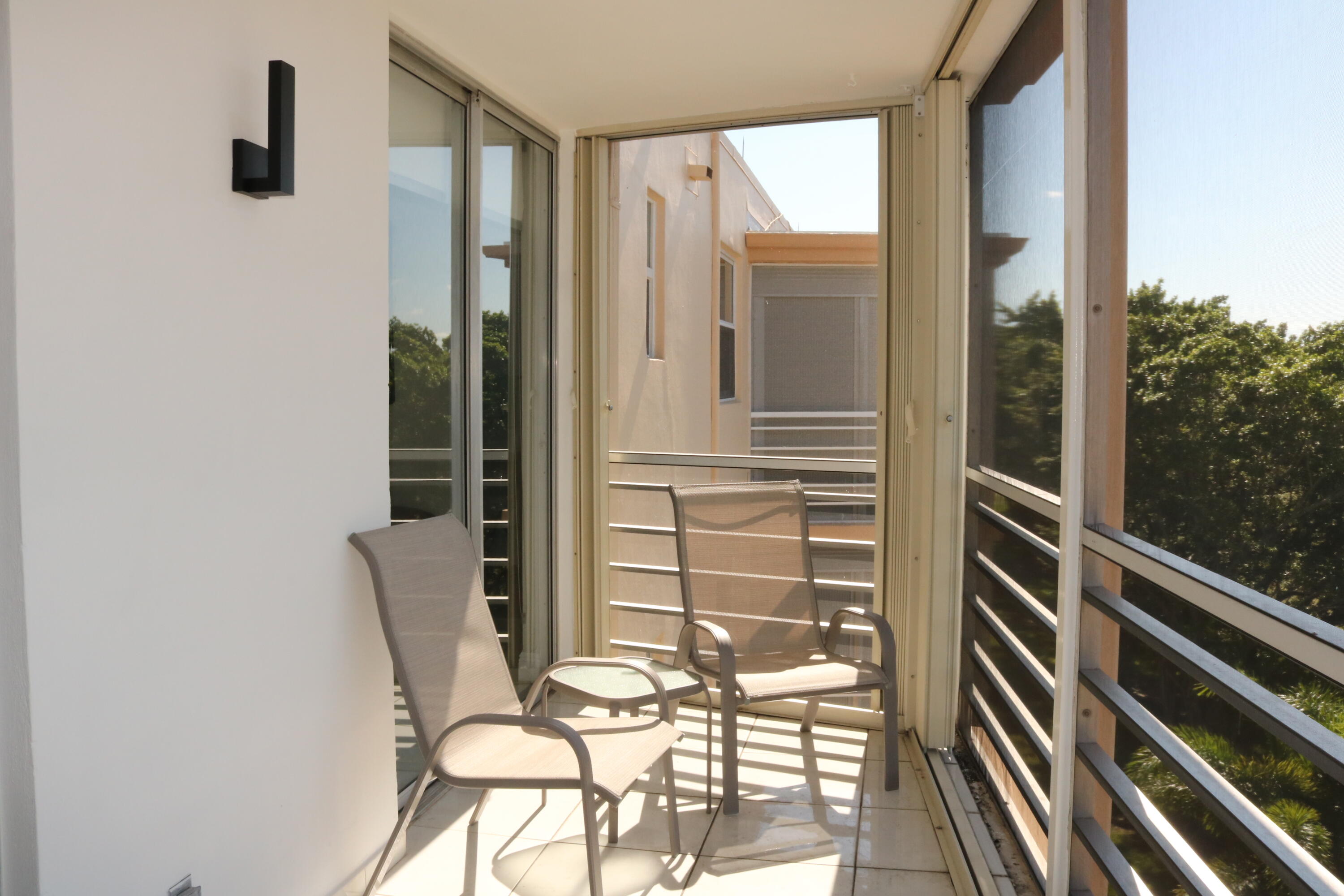 6461 Northwest 2nd Avenue, Unit 508 Boca Raton, FL 33487 - Photo 25 of 39 a view of balcony and living room