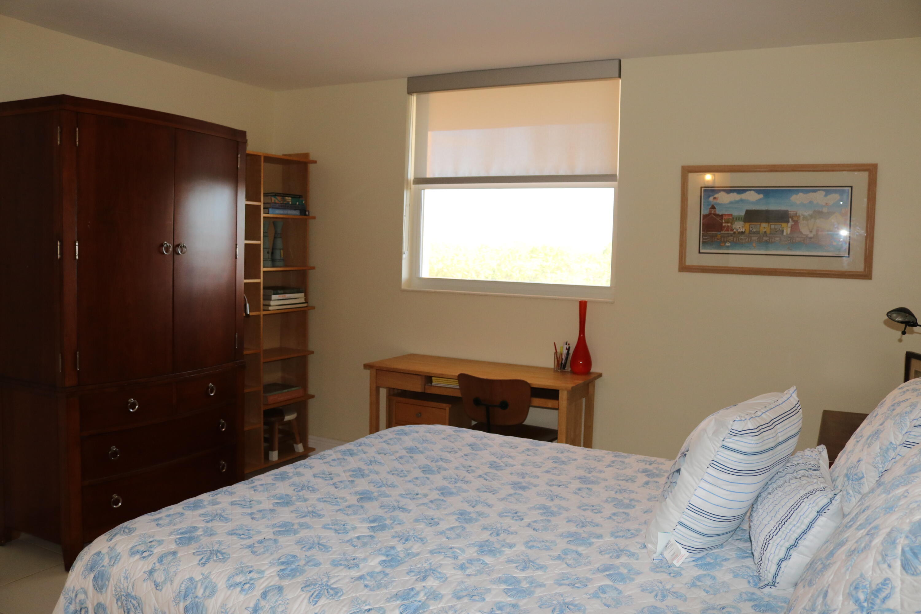 6461 Northwest 2nd Avenue, Unit 508 Boca Raton, FL 33487 - Photo 28 of 39 a bedroom with a bed and a closet