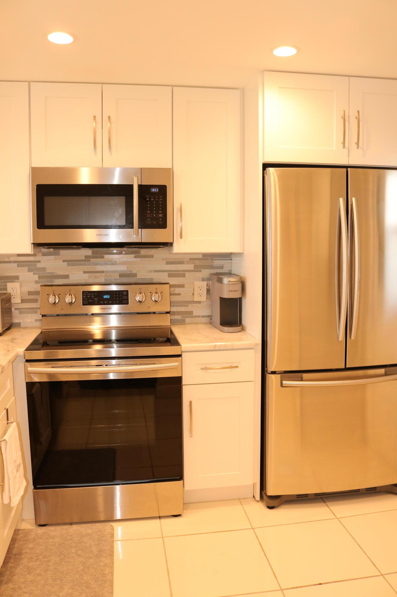 6461 Northwest 2nd Avenue, Unit 508 Boca Raton, FL 33487 - Photo 6 of 39 a stove top oven sitting inside of a kitchen