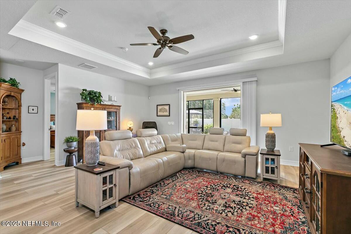22 Myrtle Oak Court St. Augustine, FL 32092 - Photo 12 of 36 a living room with furniture and a ceiling fan