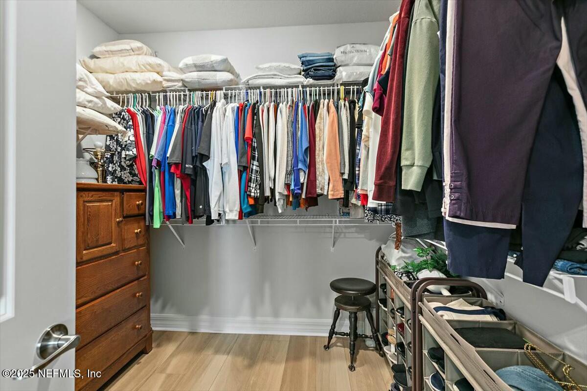 22 Myrtle Oak Court St. Augustine, FL 32092 - Photo 18 of 36 a view of walk in closet with clothes and shoes