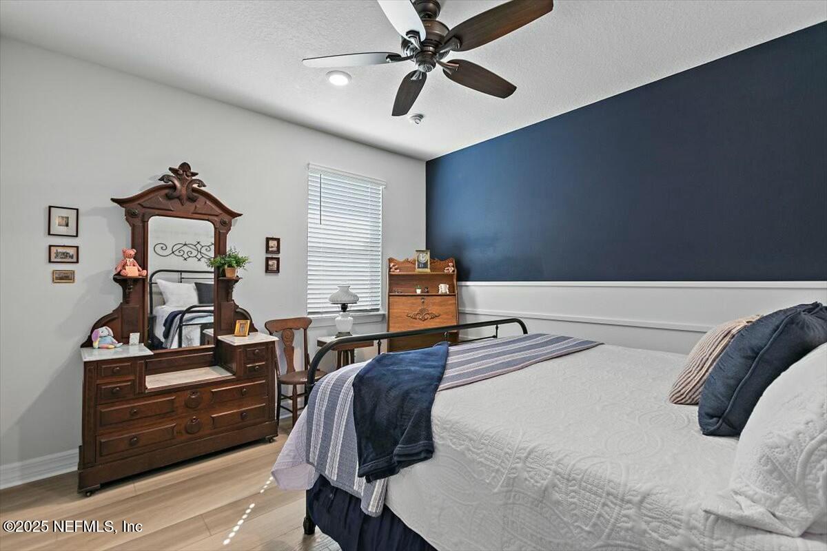 22 Myrtle Oak Court St. Augustine, FL 32092 - Photo 22 of 36 a bedroom with furniture and wooden floor