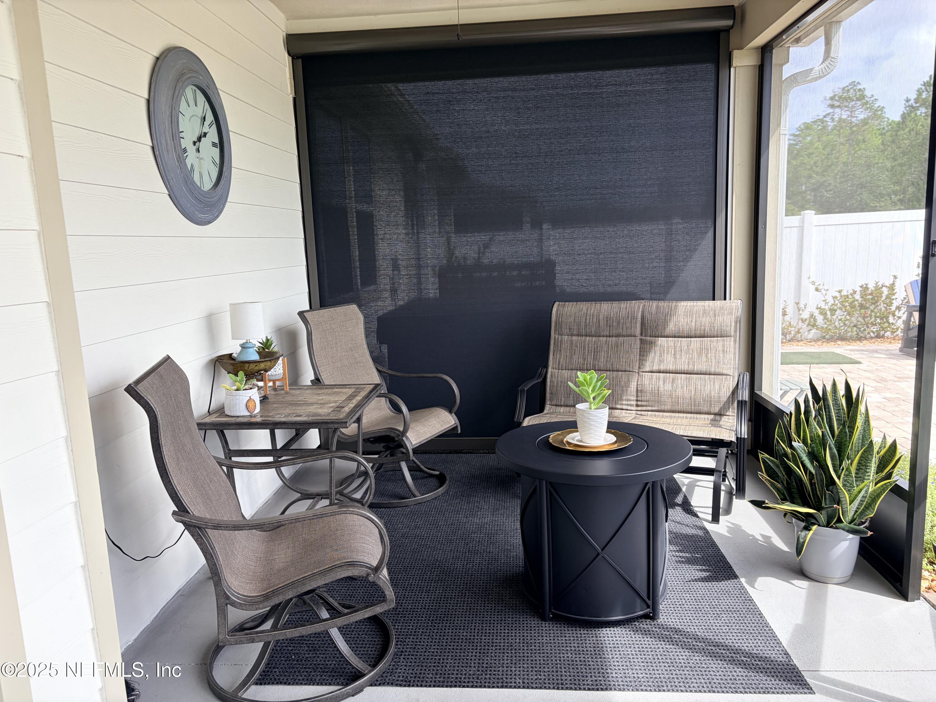 22 Myrtle Oak Court St. Augustine, FL 32092 - Photo 26 of 36 a dining room with furniture a large window and wooden floor