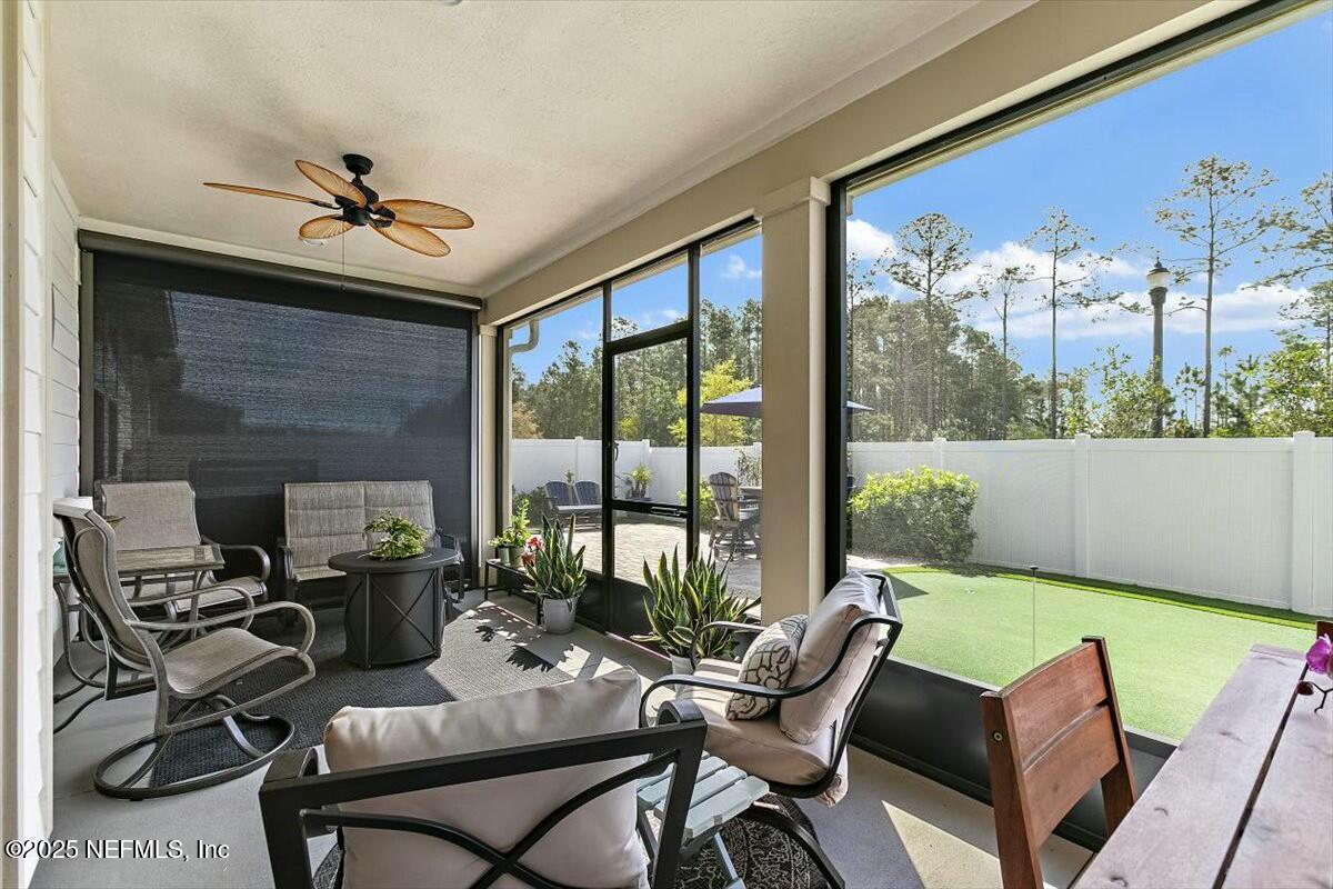 22 Myrtle Oak Court St. Augustine, FL 32092 - Photo 27 of 36 a living room with furniture and a floor to ceiling window