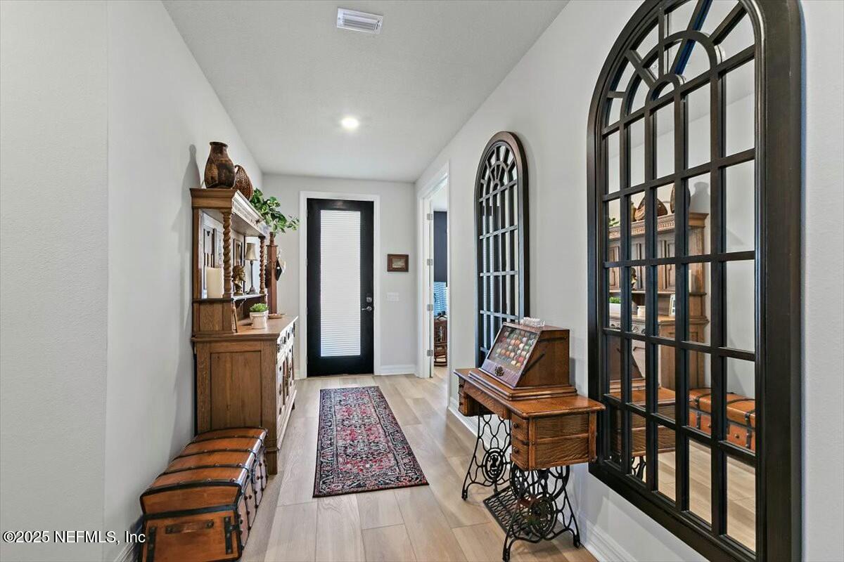 22 Myrtle Oak Court St. Augustine, FL 32092 - Photo 4 of 36 a living room with furniture fireplace and rug
