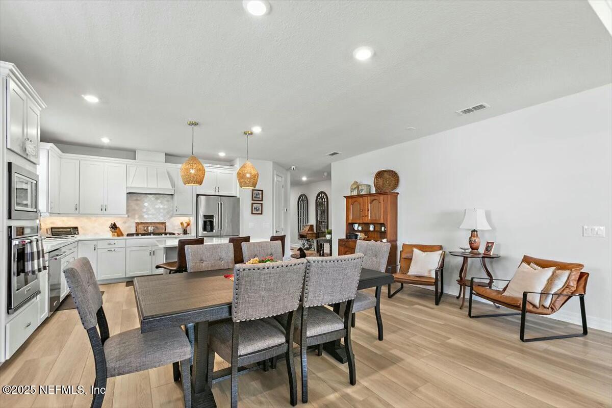 22 Myrtle Oak Court St. Augustine, FL 32092 - Photo 7 of 36 a view of a dining room with furniture