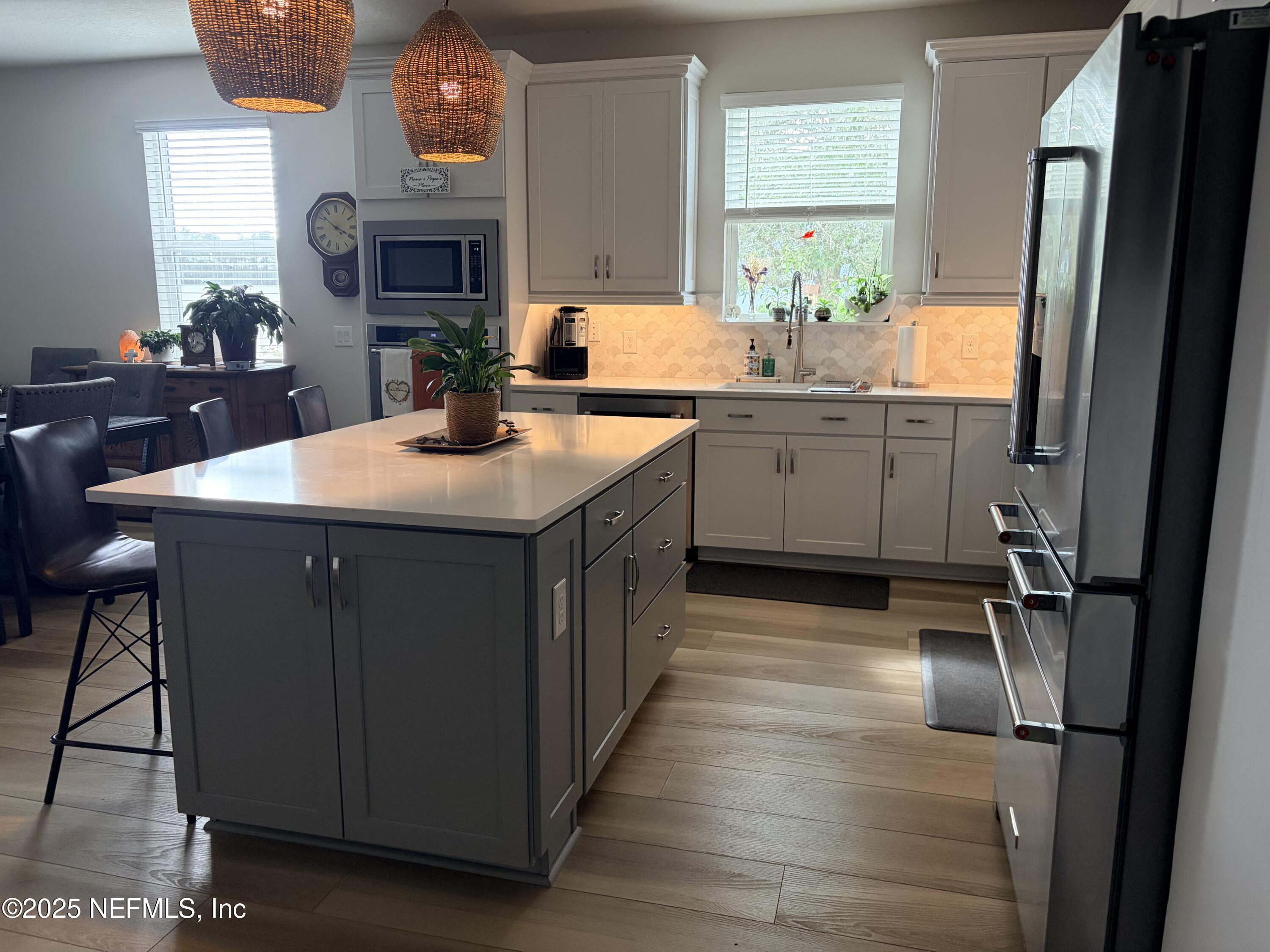 22 Myrtle Oak Court St. Augustine, FL 32092 - Photo 10 of 36 a kitchen with sink cabinets and wooden floor