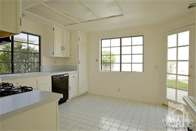 880 Congressional Road Simi Valley, CA 93065 - Photo 7 of 19 a kitchen with window and cabinets