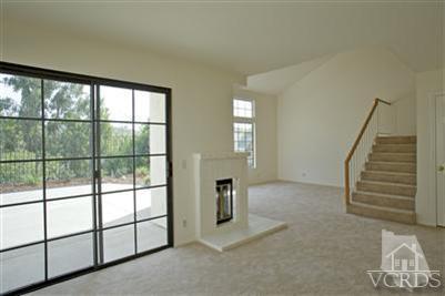 880 Congressional Road Simi Valley, CA 93065 - Photo 9 of 19 a view of empty room with stairs and wooden floor