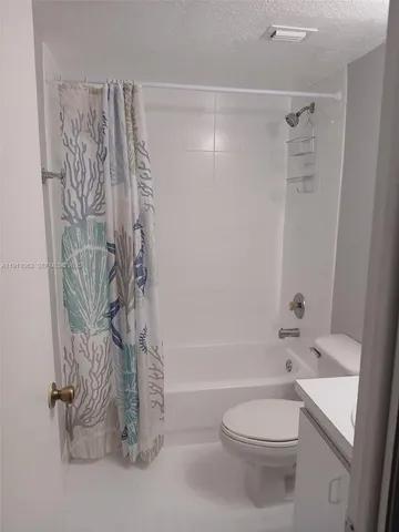 a bathroom with a bathtub and shower