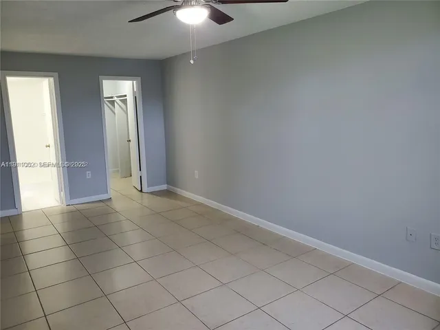 an empty room with a fireplace