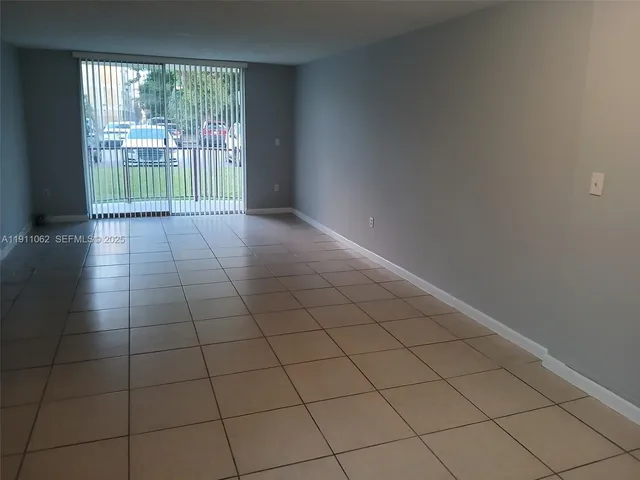 a view of hallway with wooden floor