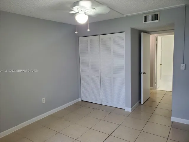 an empty room with a bathroom
