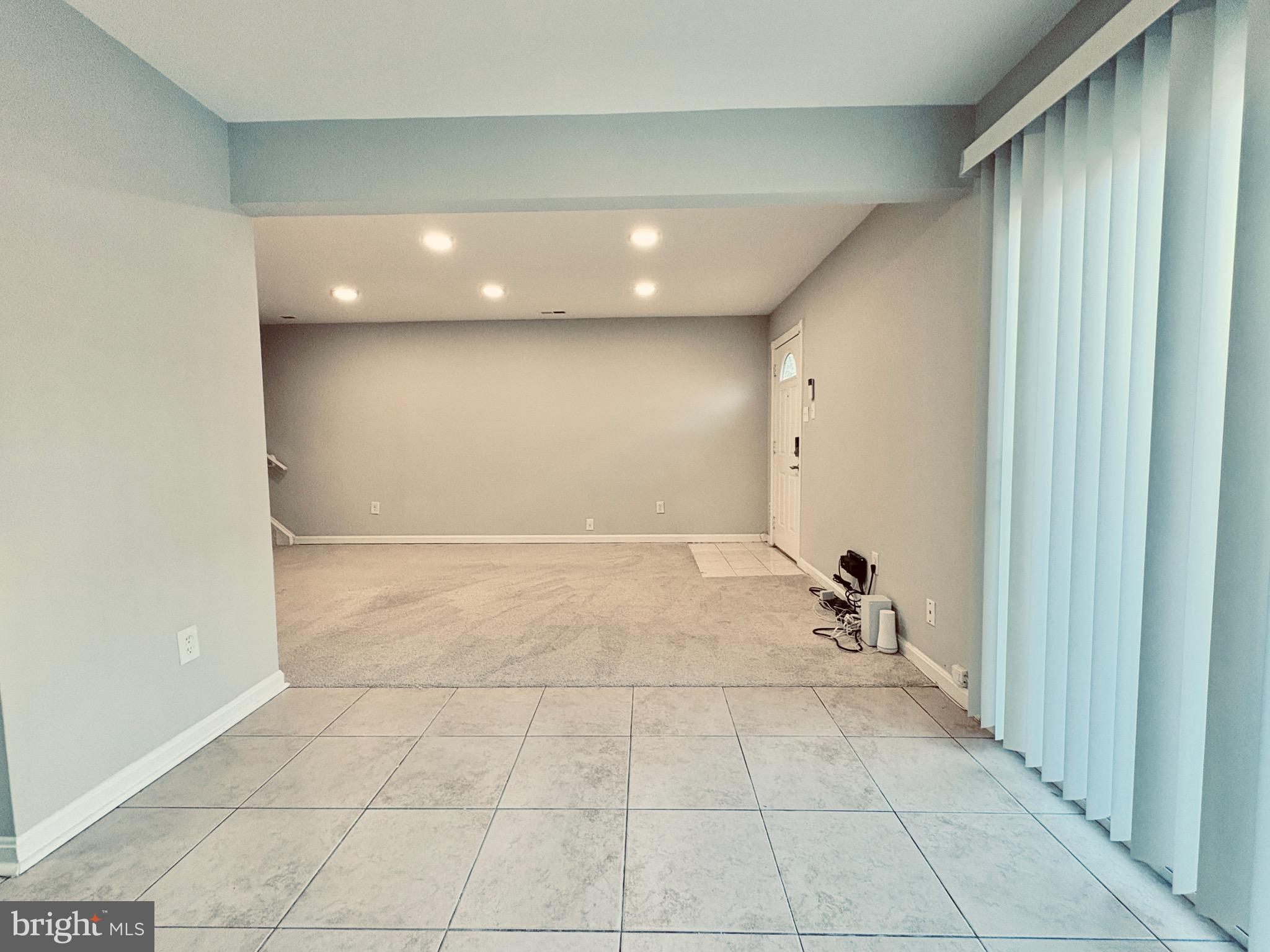 3813 Segundo Place, Unit D Alexandria, VA 22309 - Photo 9 of 28 a view of a livingroom with furniture and an entryway