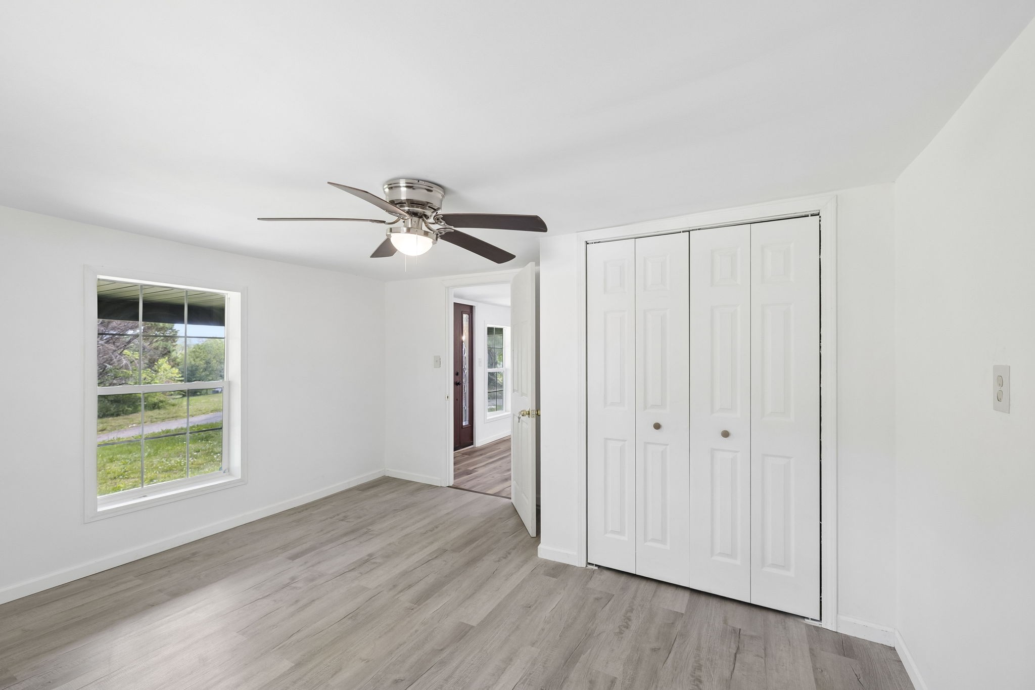 1200 Little Street Winchester, TN 37398 - Photo 11 of 54 wooden floor in an empty room with a window